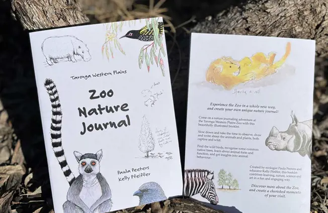 Zoo Nature Journal booklets displayed outdoors for a self‑guided nature learning activity.
