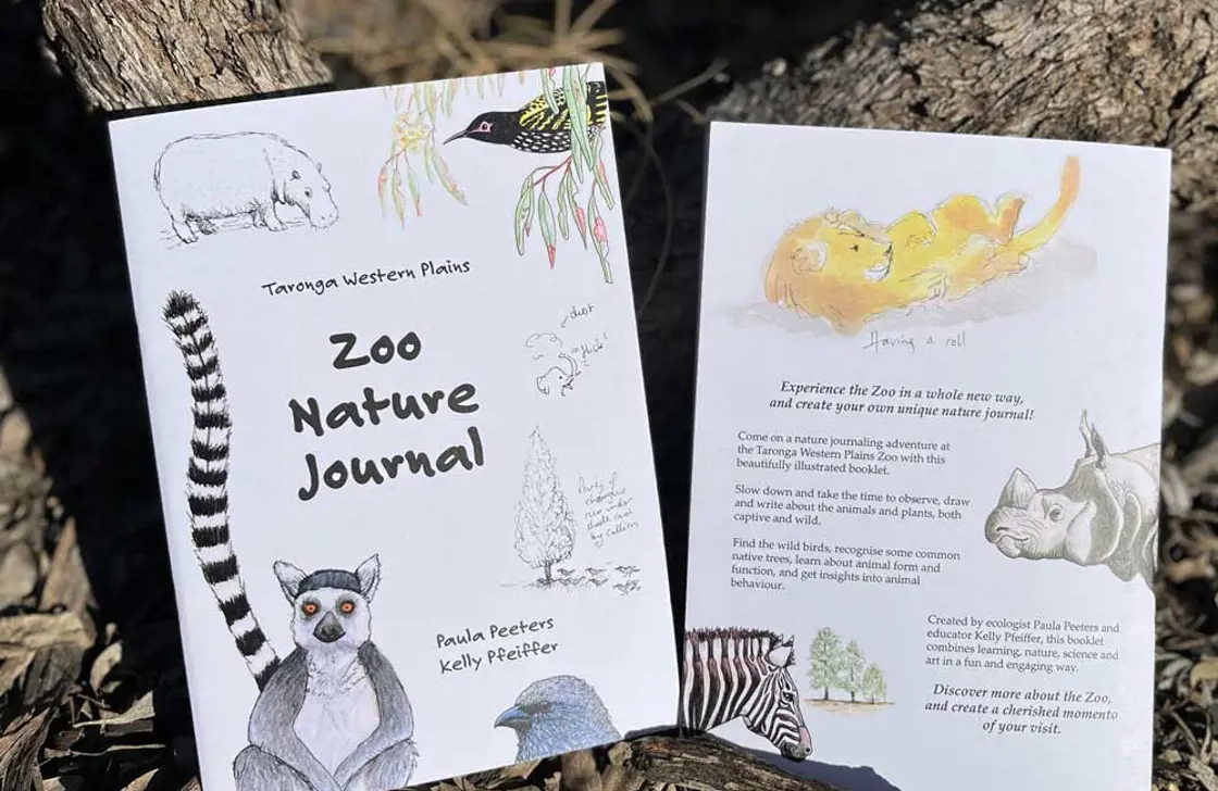 Zoo Nature Journal booklets displayed outdoors for a self‑guided nature learning activity.