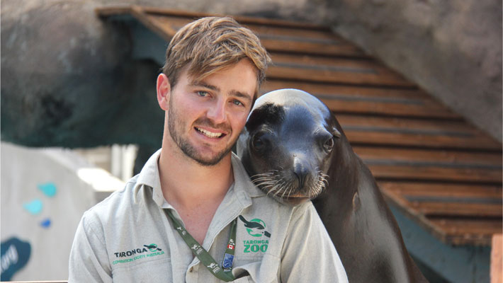 Marine Mammal Keeper with a Sea-lion.