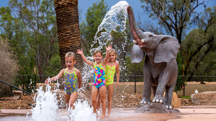 Kids playing in The Waterhole at Taronga Western Plains Zoo Dubbo.