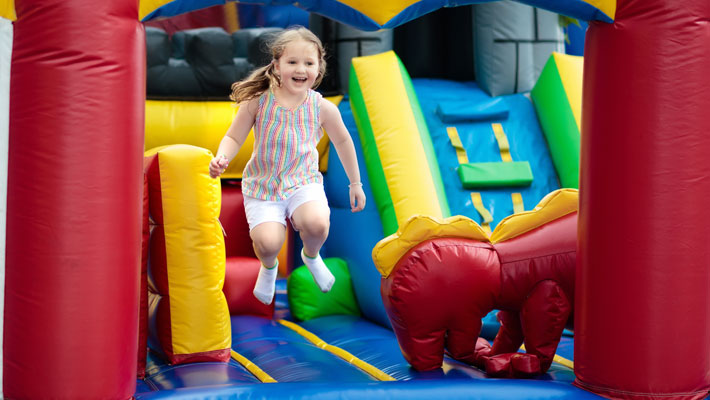 Child jumping on jumping castle