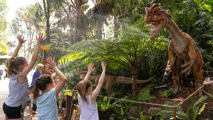 Kids playing with the spitting Dilophosaurus