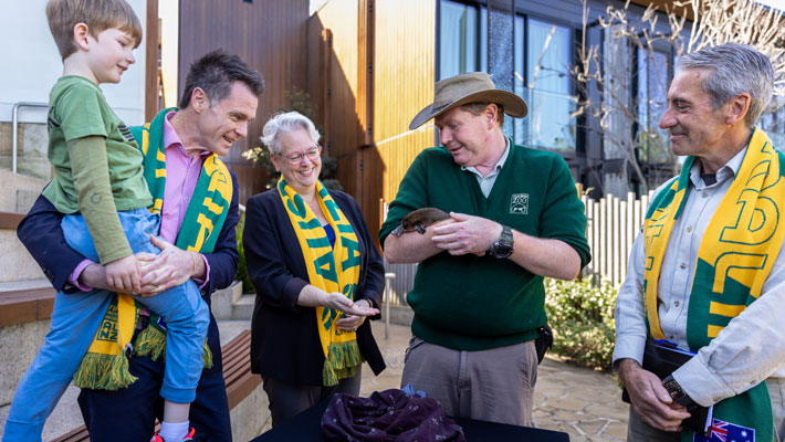 Premier Chris Minns, Minister Penny Sharpe and Taronga CEO Cameron Kerr with Keeper and Matilda the Platypus