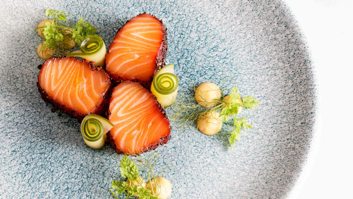 Gin-cured Tasmanian salmon, with mountain pepperberry, mayonnaise and compressed cucumber.