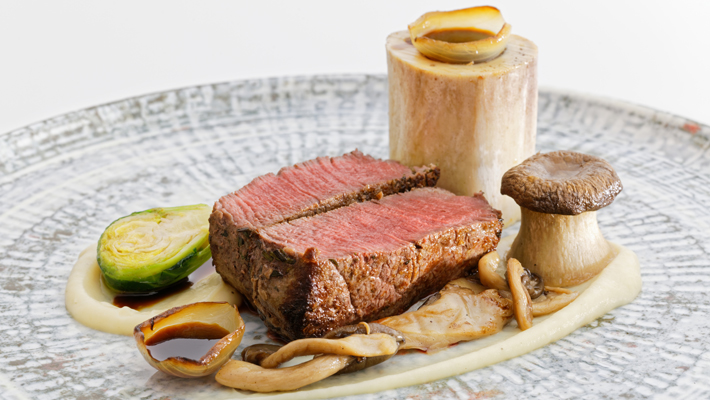 Delectable beef tenderloin with mushrooms and jus.