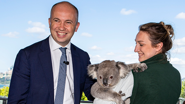 Minister for Environment, Matt Kean, and Keeper Libby Timmiss with a Koala.